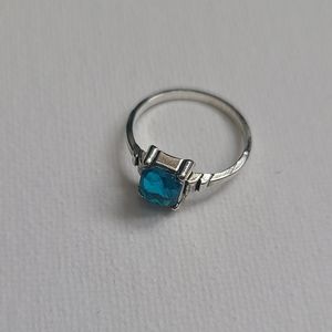 Silver ring with blue stone